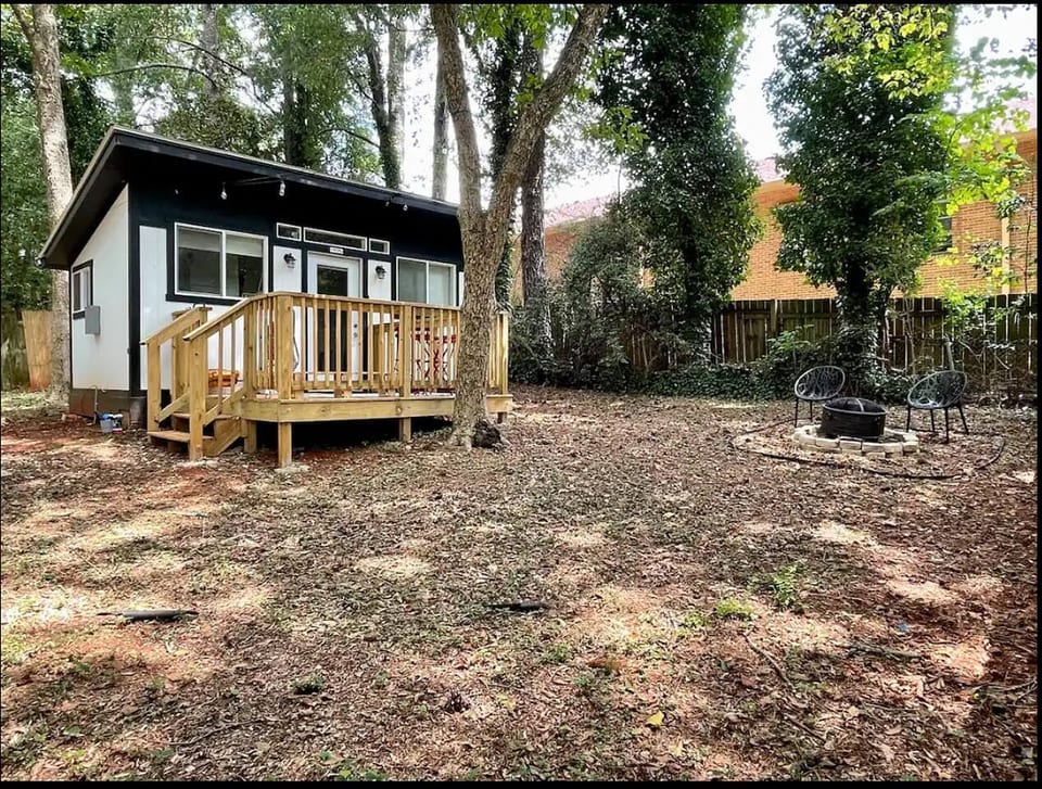 Outdoors, a fully-fenced yard, deck with a bistro set, and a fire pit await. Pet-friendly for your furry friends!