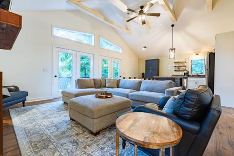 The upper level sitting area has a great sectional couch and two comfy leather chairs!