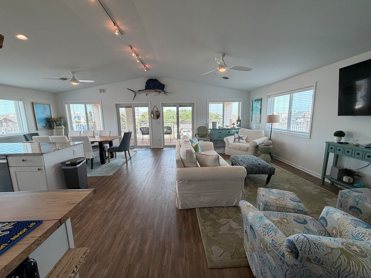 Welcome to this warm and cheery open floor plan! 1 block from the beach!