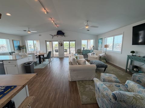 Welcome to this warm and cheery open floor plan! 1 block from the beach!