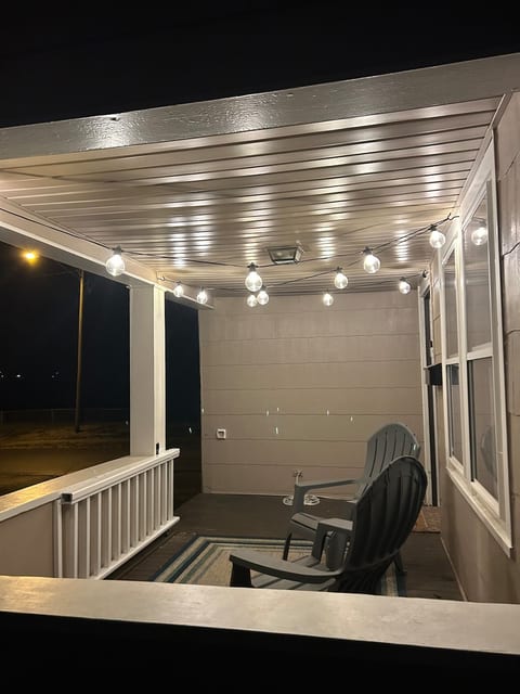 Sliding gate on front porch to contain small pets or little ones.