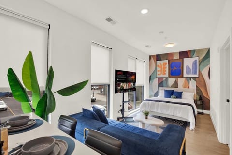Bright modern studio with bold design, cozy lounge area, and natural light
