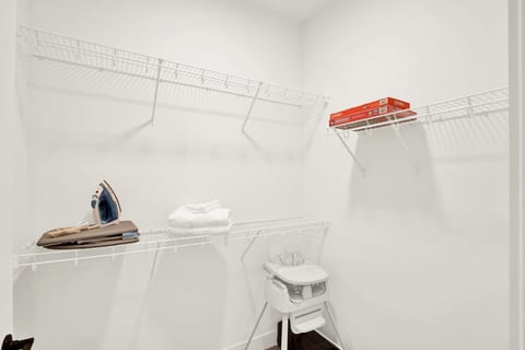 Spacious utility closet with storage, fresh linens, and family-friendly extras