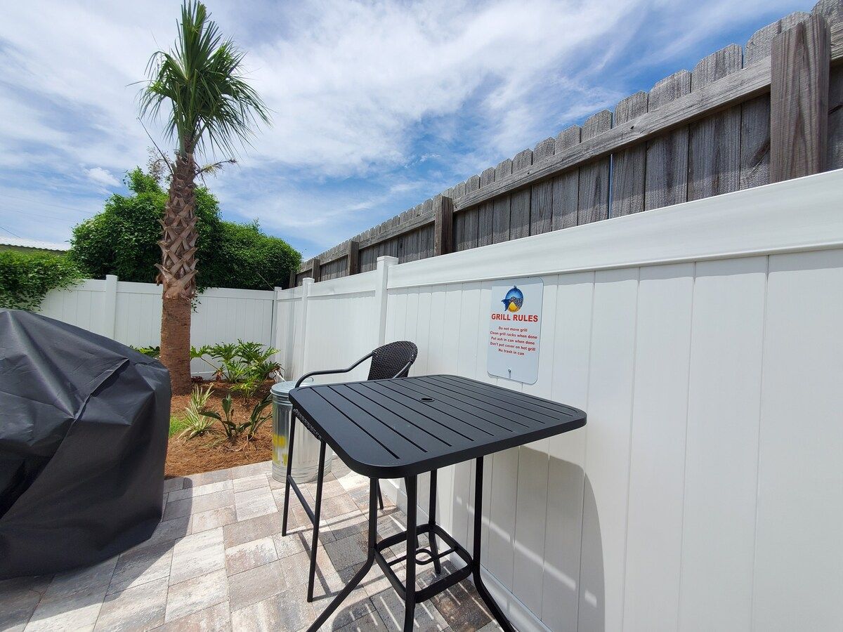Barbecue charcoal Grill area with prep table and chair for Dad