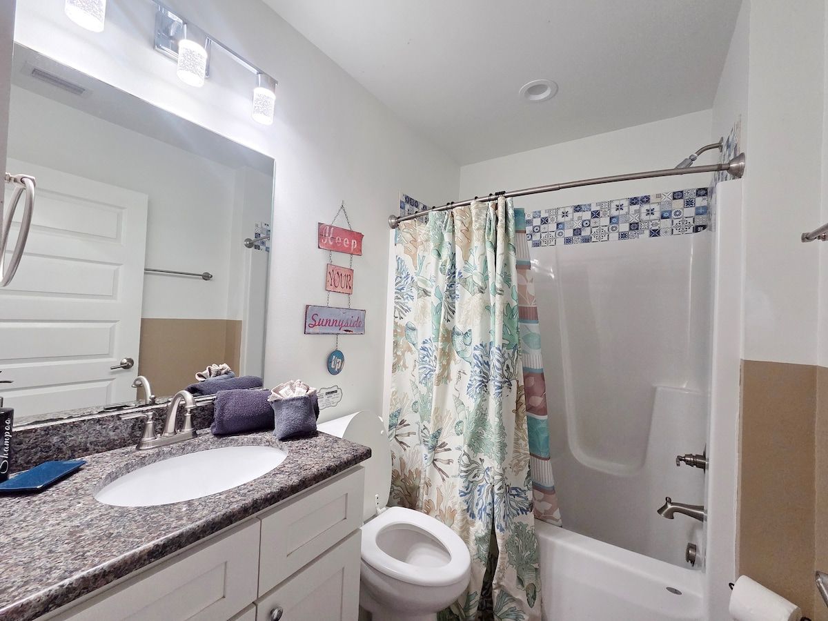 2nd Bathroom w/ Shower Tub Combo, Full size Vanity, and toilet.