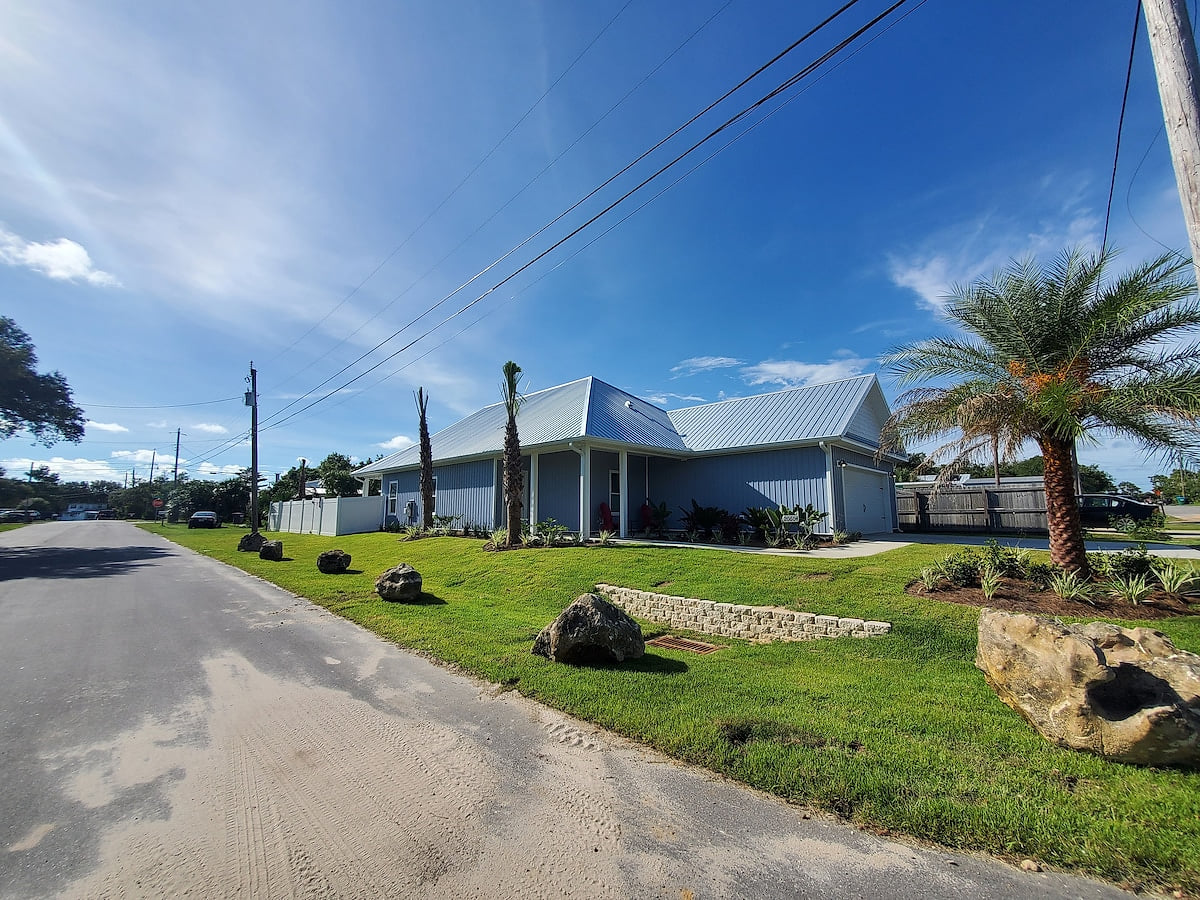 Beautiful Palms, Coral, and Tropical Plants decorate this tropical paradise!  Room for 4 vehicles, 2 in the garage and 2 in the drive way!