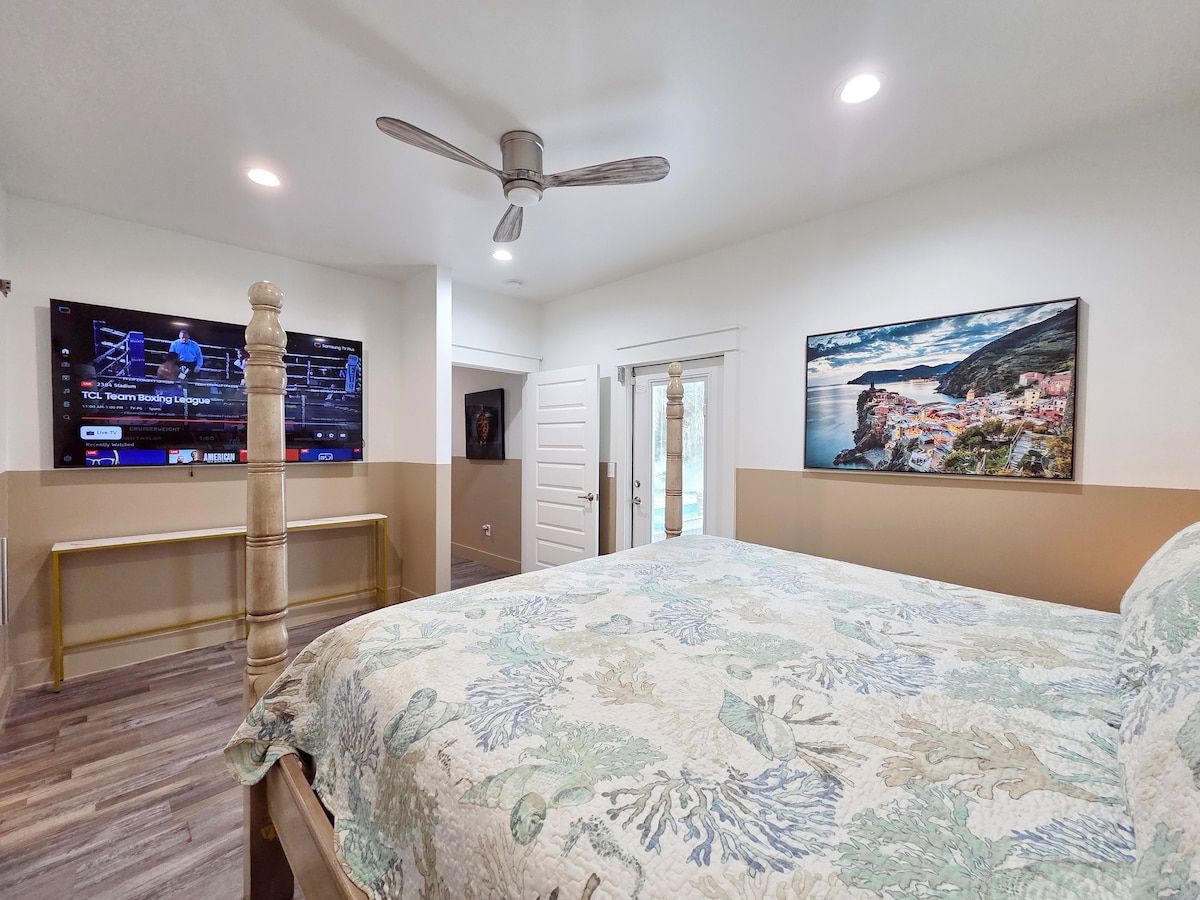 Master Bedroom with king size memory foam mattress, 75" Samsung Smart TV, Night stands w/power strips for hungry phone chargers walk in closet w/extra pillows and blankets, master bath w/ walk in shower and private access to pool.