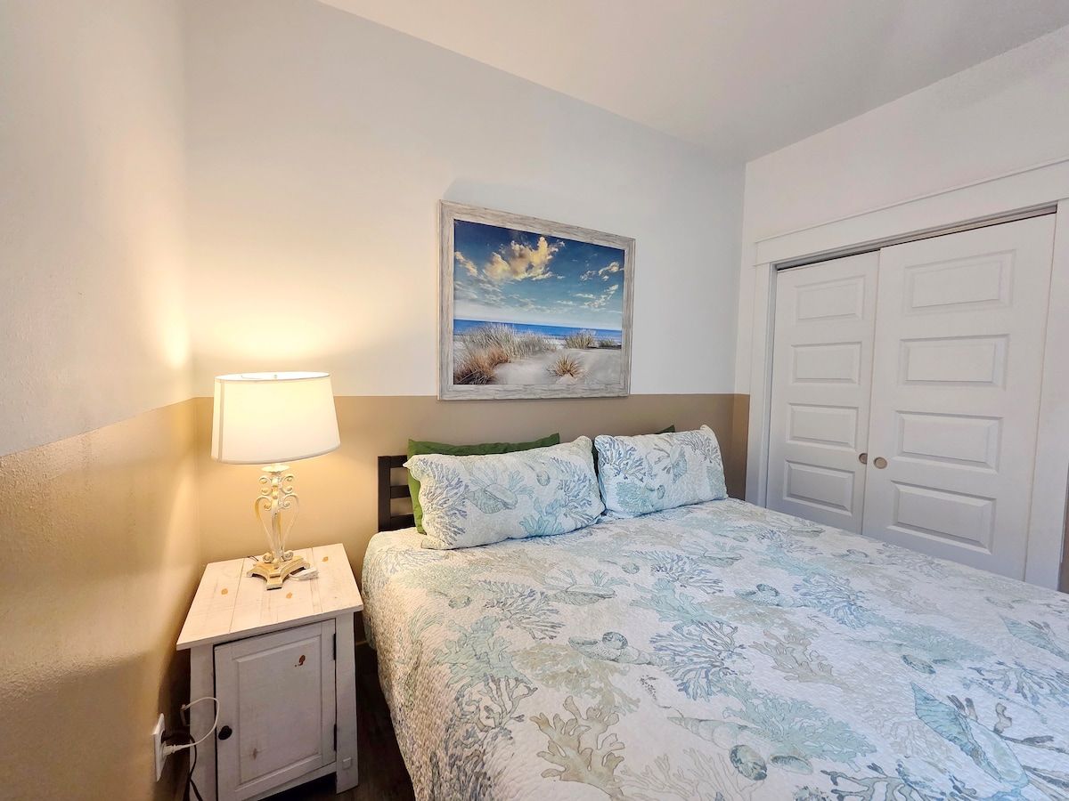 2nd Bedroom with King Size Memory Foam mattress, 70" Samsung Smart TV, Night stand w/power strips for hungry phone chargers, ample closet space w/extra pillows and blankets.