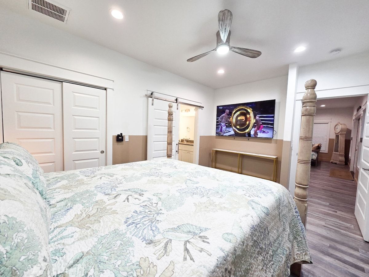 Master Bedroom with king size memory foam mattress, 75" Samsung Smart TV, Night stands w/power strips for hungry phone chargers walk in closet w/extra pillows and blankets, master bath w/ walk in shower and private access to pool.