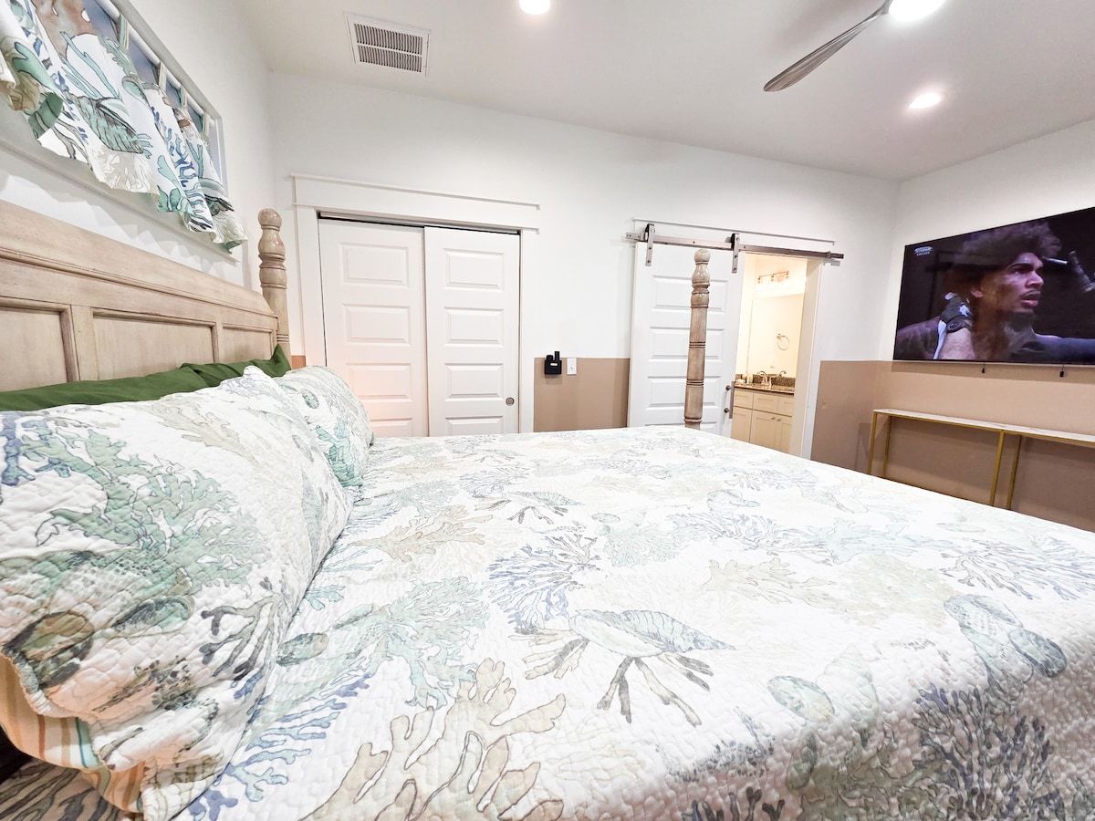 Master Bedroom with king size memory foam mattress, 75" Samsung Smart TV, Night stands w/power strips for hungry phone chargers walk in closet w/extra pillows and blankets, master bath w/ walk in shower and private access to pool.