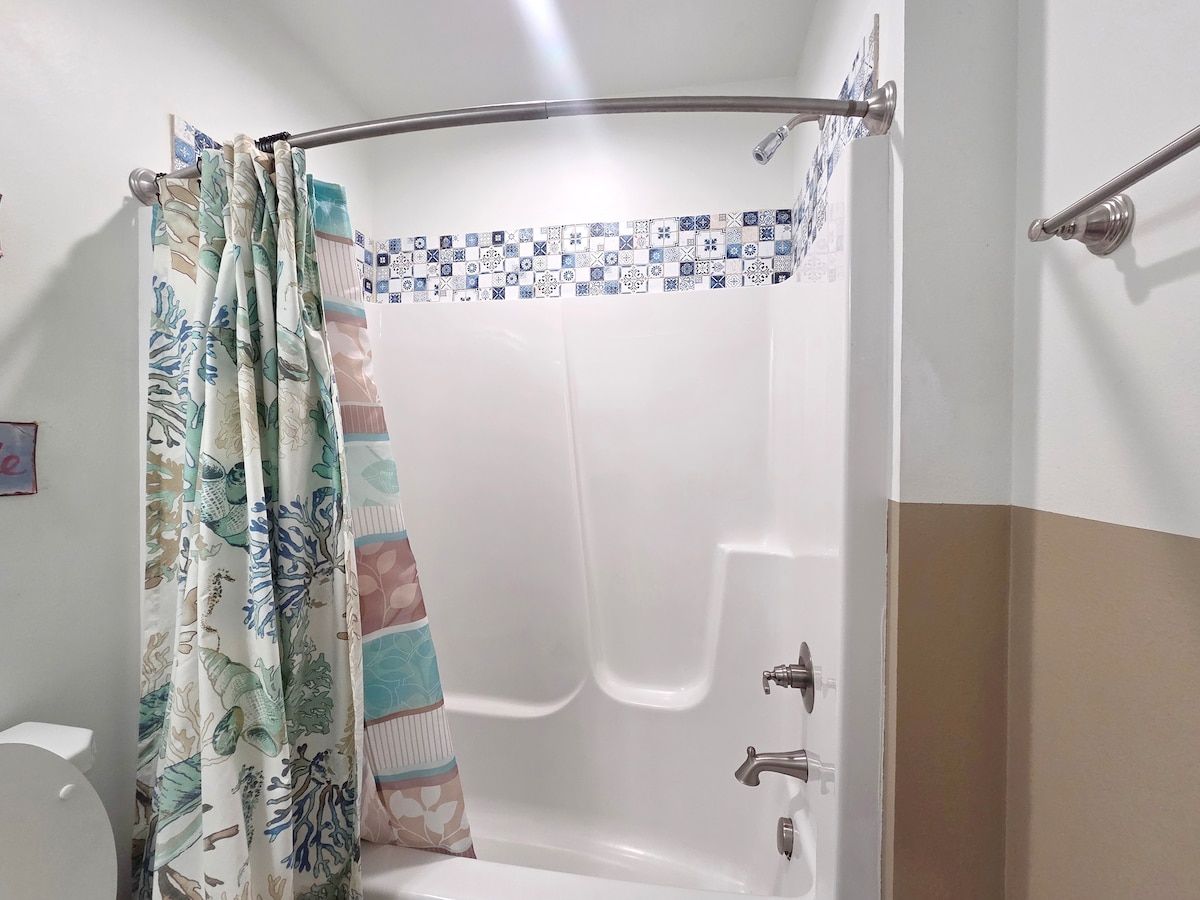 2nd Bathroom w/ Shower Tub Combo, Full size Vanity, and toilet.