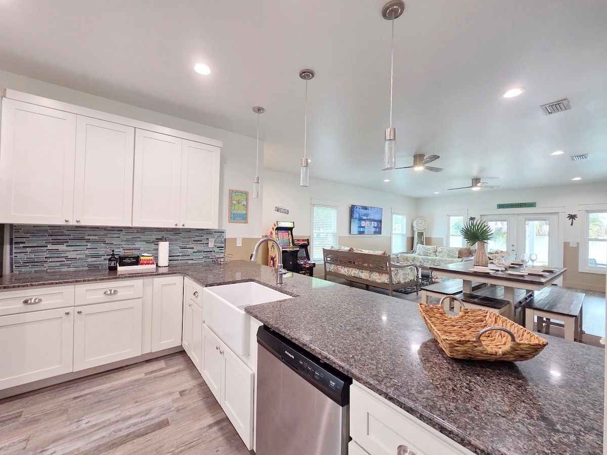 Kitchen w/ all new Stainless Steel appliances including a dishwasher, microwave, coffee maker, blender, and toaster. Room at the bar to sit and enjoy a snack or eat any meal.