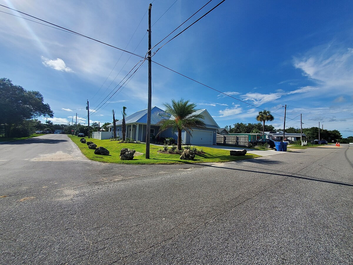 Beautiful Palms, Coral, and Tropical Plants decorate this tropical paradise!  Room for 4 vehicles, 2 in the garage and 2 in the drive way!