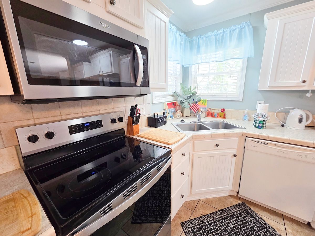 Kitchen with seating for 6 and all necessary items to cook a full meal with Stove, Microwave, Refrigerator, Dishwasher, Coffee Maker, Blender, Toaster, crock pot, etc.