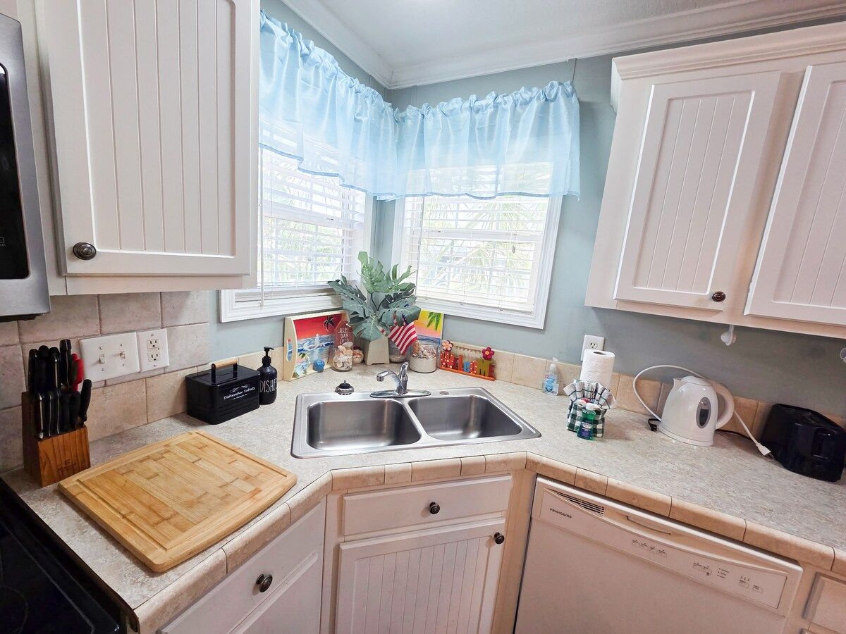 Kitchen with seating for 6 and all necessary items to cook a full meal with Stove, Microwave, Refrigerator, Dishwasher, Coffee Maker, Blender, Toaster, crock pot, etc.