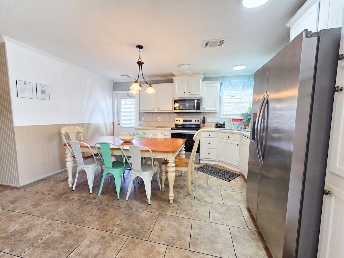 Kitchen with seating for 6 and all necessary items to cook a full meal with Stove, Microwave, Refrigerator, Dishwasher, Coffee Maker, Blender, Toaster, crock pot, etc.