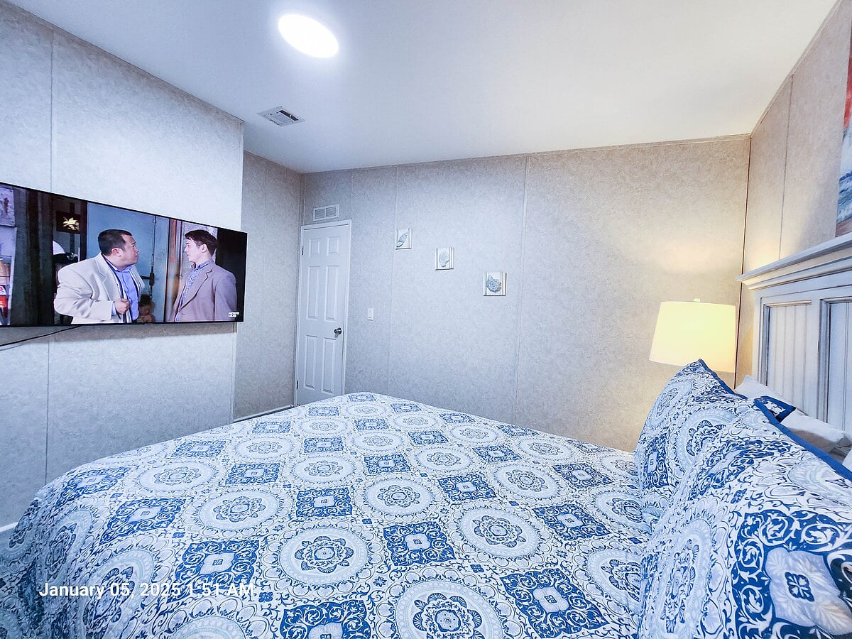 2nd Bedroom w/ Queen size Bed, Lamps, 55" Samsung Smart TV and power strips by night stands for phone chargers