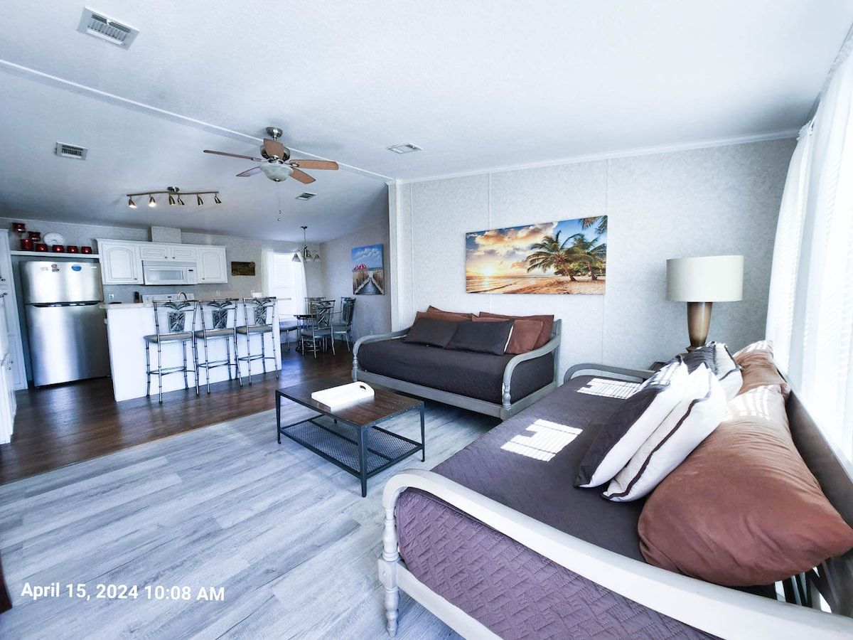 Large Den, 2 comfortable daybeds with memory foam mattresses, with open space to kitchen and dining room along with 55" Samsung Smart TV