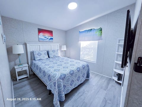 2nd Bedroom w/ Queen size Bed, Lamps, 55" Samsung Smart TV and power strips by night stands for phone chargers