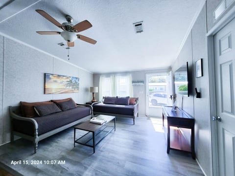 Large Den, 2 comfortable daybeds with memory foam mattresses, with open space to kitchen and dining room along with 55" Samsung Smart TV