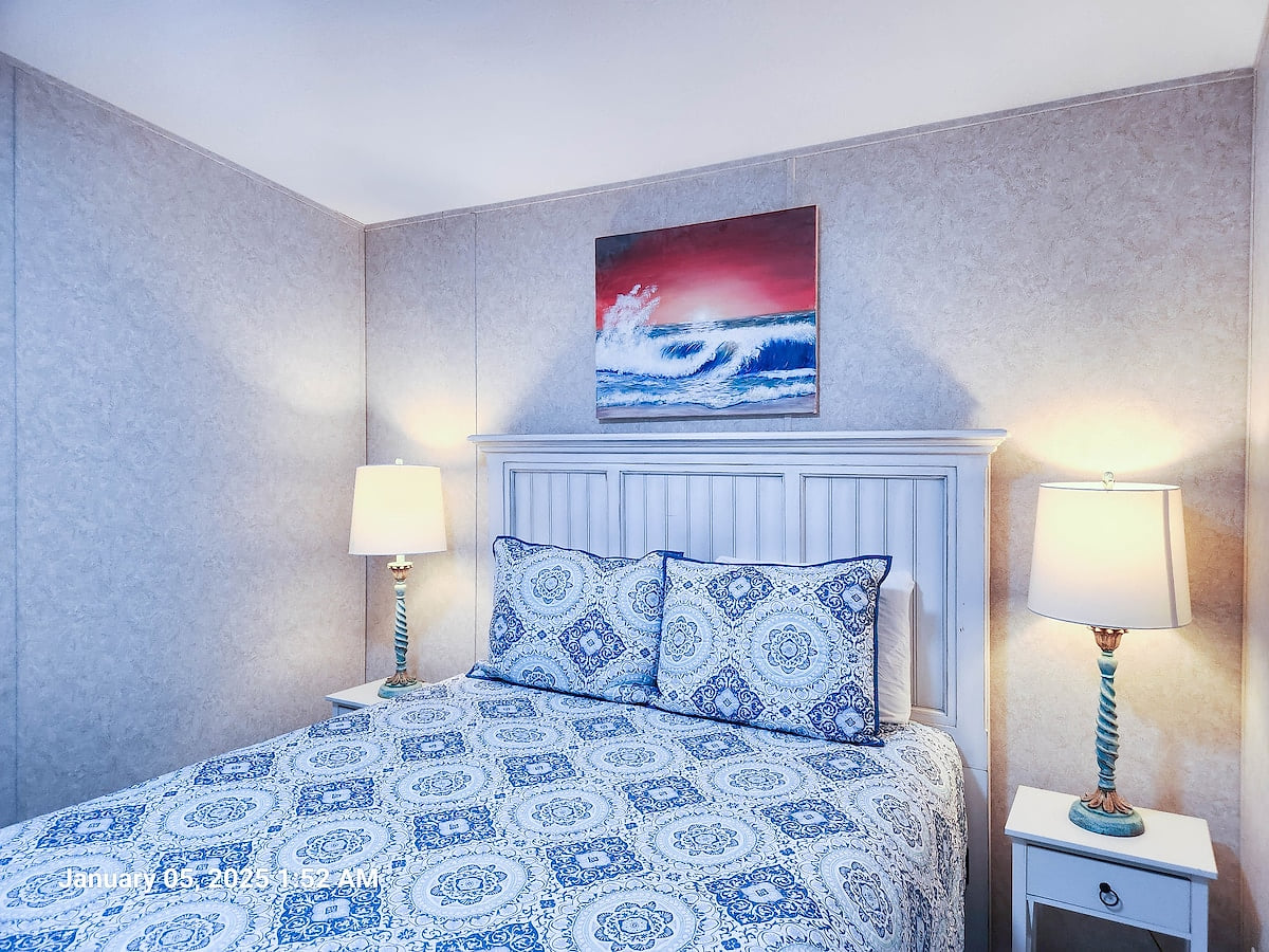 2nd Bedroom w/ Queen size Bed, Lamps, 55" Samsung Smart TV and power strips by night stands for phone chargers