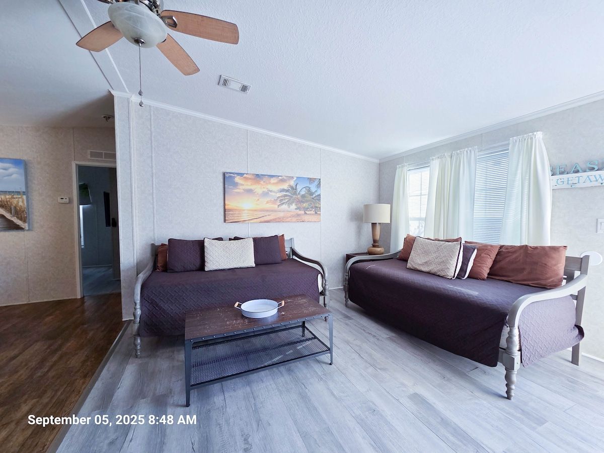 Large Den, 2 comfortable daybeds with memory foam mattresses, with open space to kitchen and dining room along with 55" Samsung Smart TV