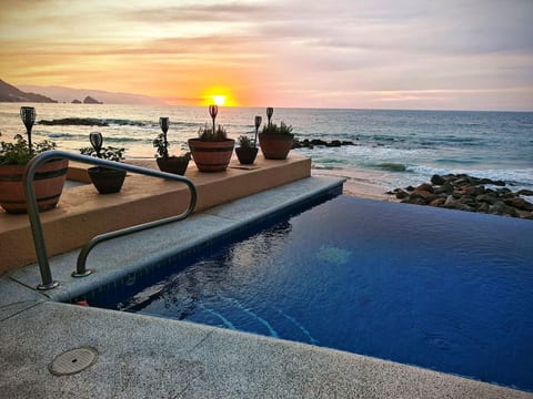 Enjoy the sunset from your private infinity pool