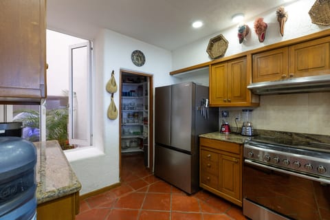 Kitchen with Pantry and Open View to Patio with Fountain