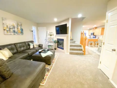 Entryway View: Huge sectional, TV, room to gather
