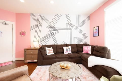 Lounge in style with this massive sectional and trendy backdrop perfect for your girls trip pics