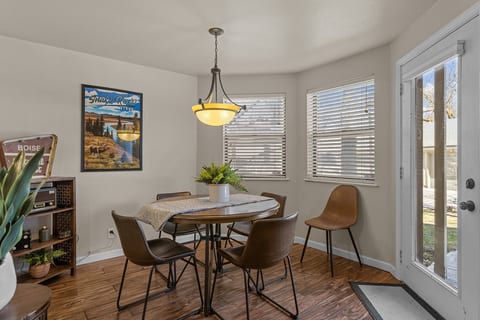 dining area surrounded by windows to the back