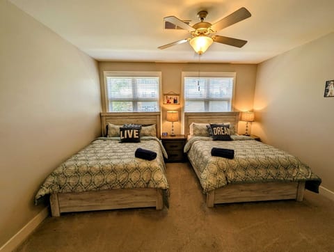 Second Bedroom- 2 Queen Beds with En-Suite Bathroom and single foldaway bed in closet