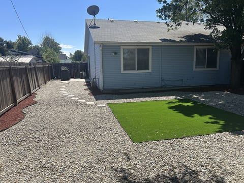 grill and fully fenced backyard