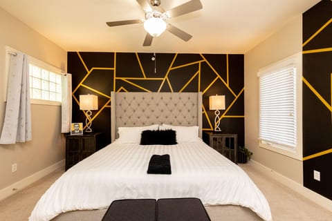 Master Bedroom with King Bed, En-suite Bathroom, Private Balcony, and Desk