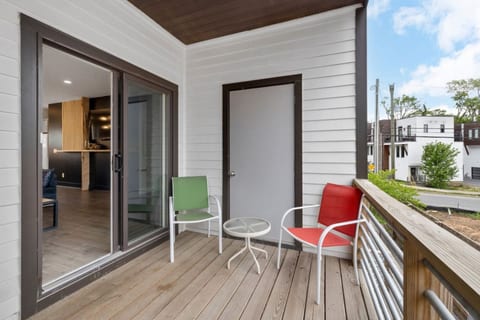 Step outside onto the private balcony to enjoy your morning coffee or an evening drink with neighborhood views.