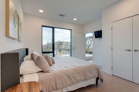 Master Bedroom with closet and en suite bathroom and gorgeous view of the river