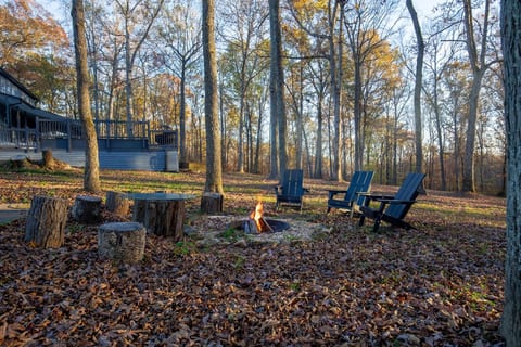 Chairs surrounding our custom fire pit; perfect for cool weather.