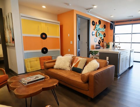 Kick back on our ultra-plush leather sofa and admire the retro, Music City-inspired design touches