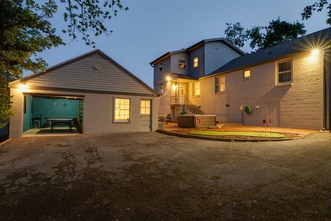 : Private backyard oasis featuring an outdoor game space and plenty of room to hang out. ✨