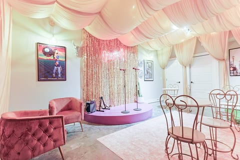 Fun photo-op corner with a shimmering gold tinsel backdrop. ✨