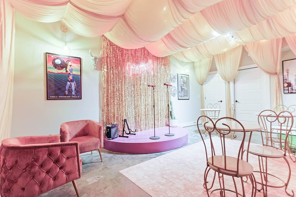 Fun photo-op corner with a shimmering gold tinsel backdrop. ✨
