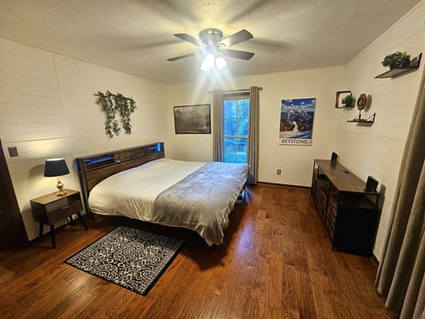 Comfortable bedroom with rustic wall decor