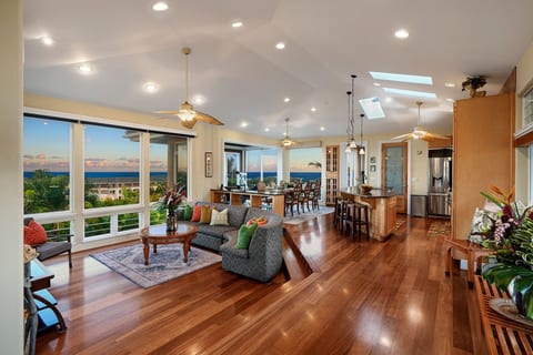 Living room, open floorplan with panoramic ocean views, sunrise, moonrise, whale watching here. The whole house has wifi speaker playing your musics