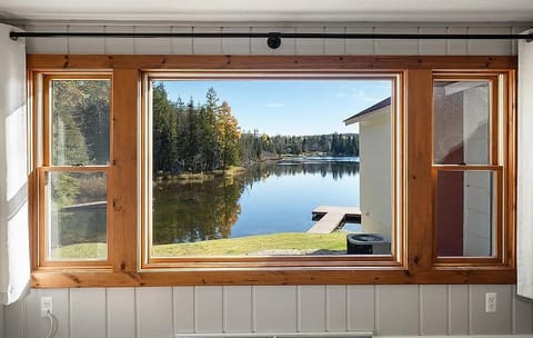 Relax inside with peaceful lake views through large windows that bring the outdoors in.