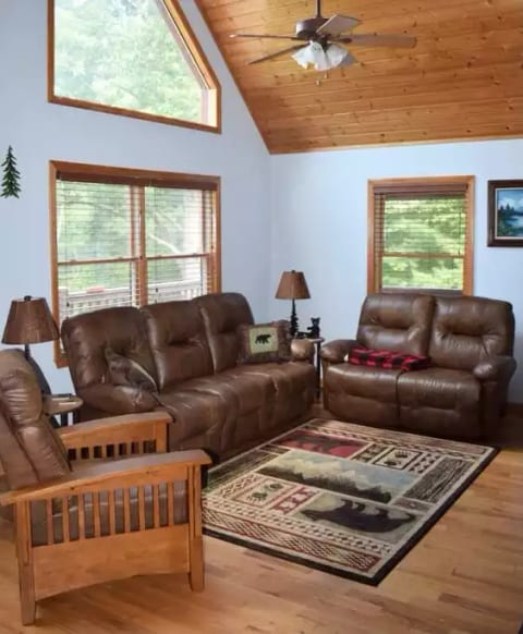 LIVING ROOM
Couch, love seat, recliner, ceiling fan, 65 inch Smart TV with a gas log fireplace and plenty of windows.