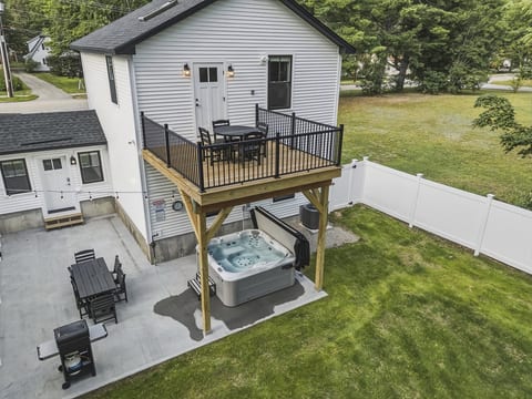 Carriage House: Hot tub, fully fenced in yard with Weber Grill, Multiple Outdoor dining tables, huge patio, and upper deck