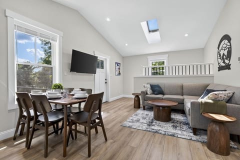 Carriage House: Sun-filled cathedral ceiling open concept living room/kitchen makes this carriage house feel bright, open, spacious and cozy all at the same time!