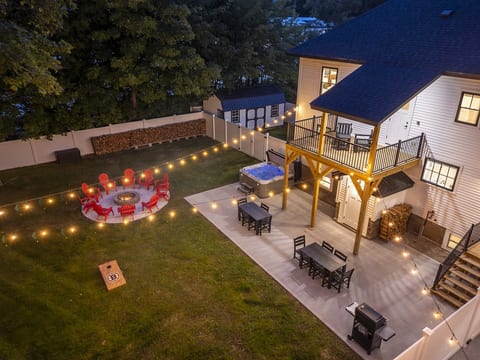 Big House: Large flat fully fenced in yard complete with a hot tub, fire pit, grill, swing set, and more