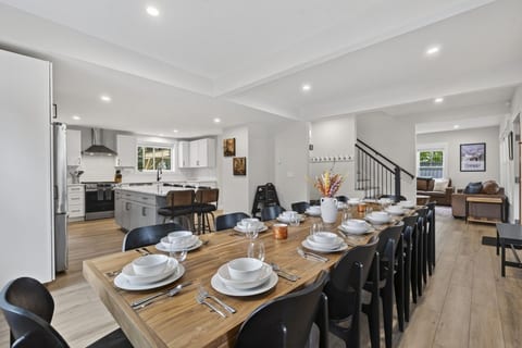 Big House Kitchen: Open concept kitchen/dining room with brand new stainless steel appliances and a huge dining table and oversized quartzite island perfect for entertaining and those large group meals