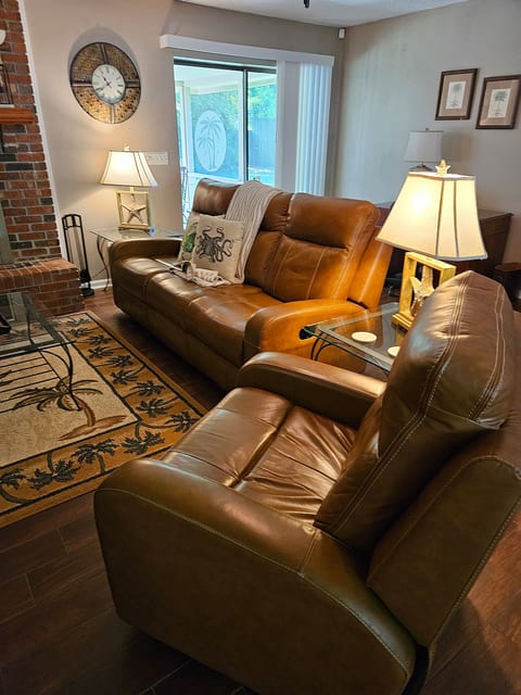 Living Room has 4 recliners, 2 stand alone and 2 on ends of couch
